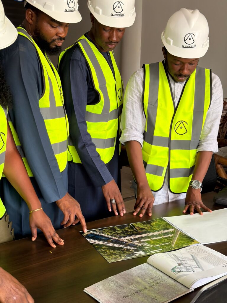 African engineers reviewing site plans in Abuja