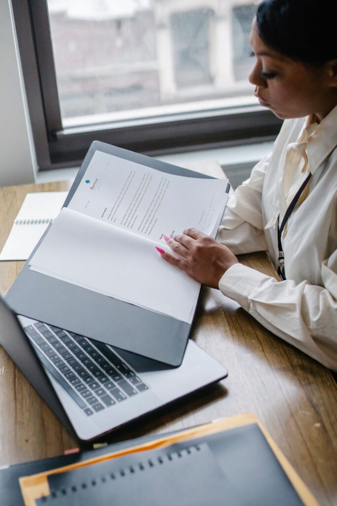 Professional reviewing project reports in an office