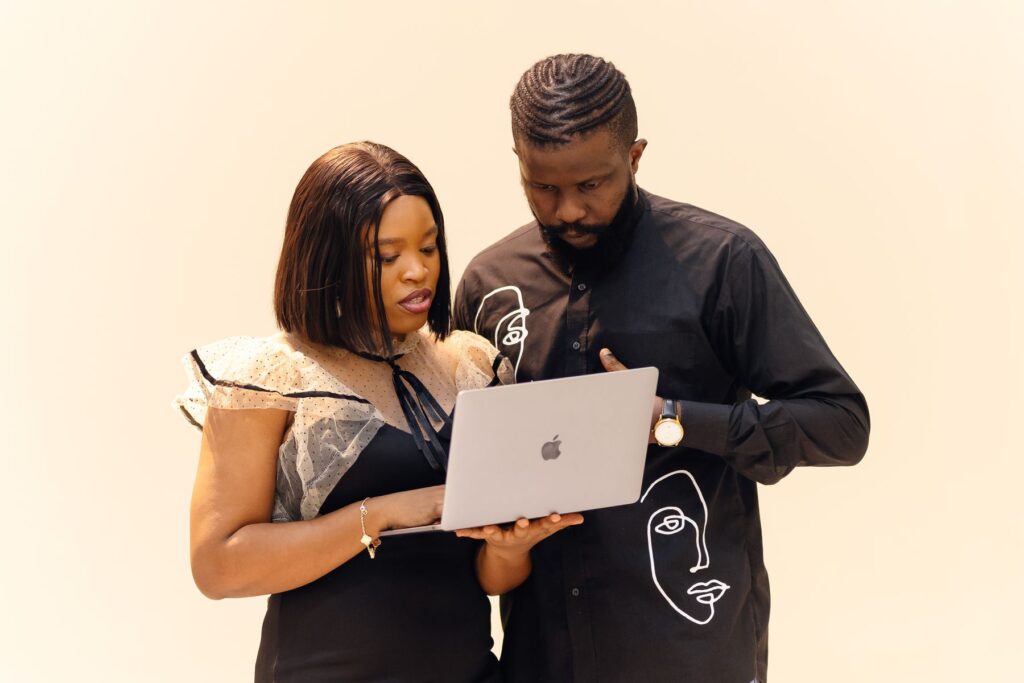 African professionals collaborating over a laptop