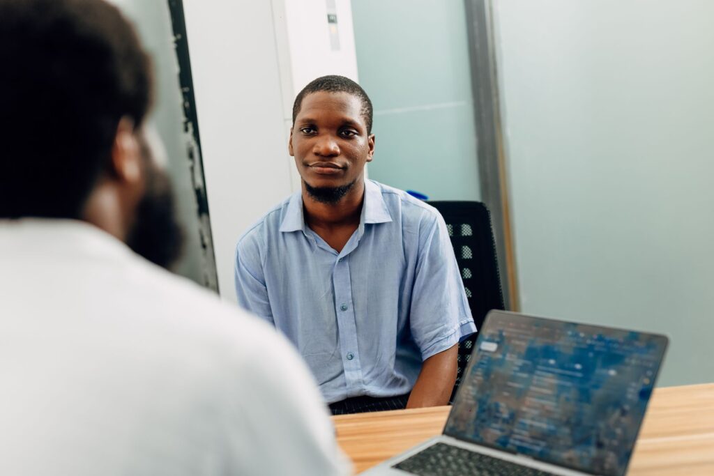 African professionals in a focused Lagos office conversation