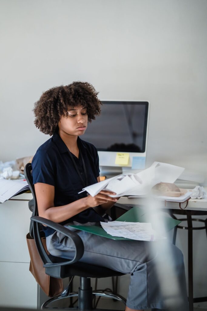 Professional reviewing documents at an office desk